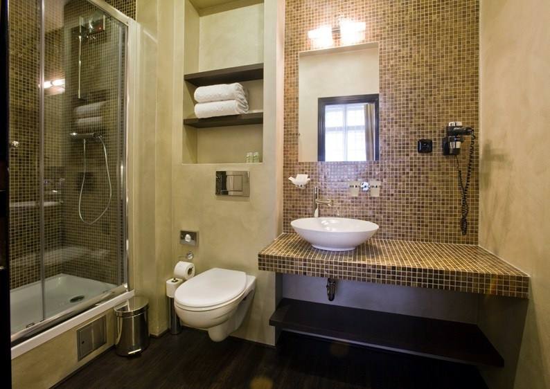 Amber room bathroom with amber mosaic, vessel basin and shower